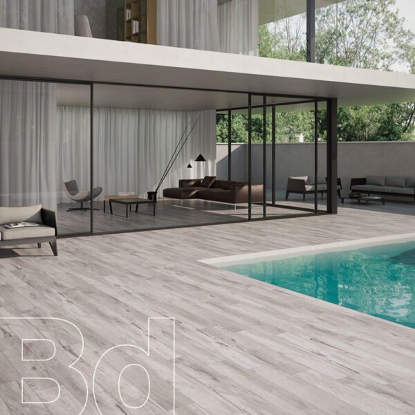 Modern glass-walled living area opening to a wooden deck with a turquoise pool, outdoor seating, and greenery; 'B30' watermark.
